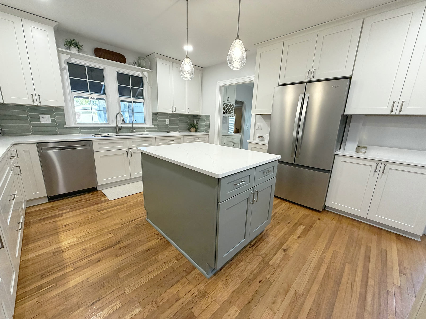 Custom white shaker cabinetry and quartz countertops in a South Tampa kitchen remodel by 618 Construction