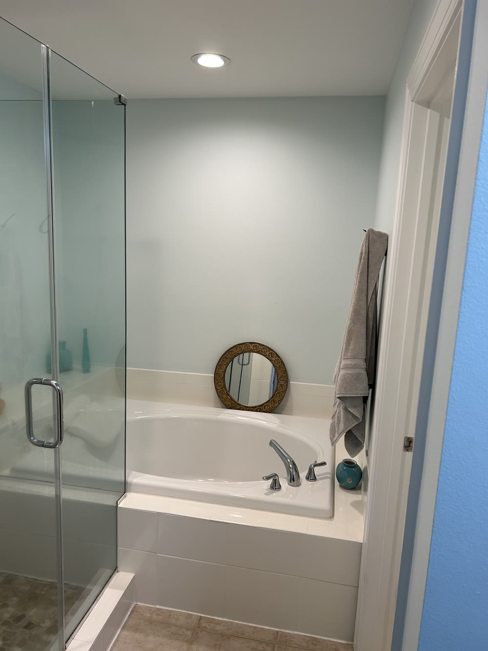Dated St. Petersburg master bathroom with a garden tub before renovation by 618 Construction